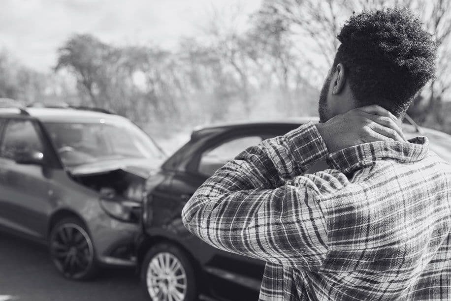 Man holding his neck after being in a car accident