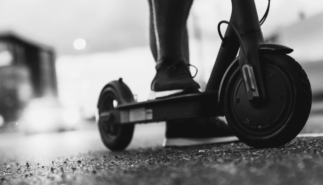 person standing on an e-scooter